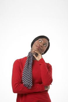 Happy African American woman daydreaming on white background