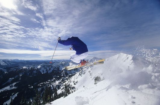 Skier jumping on mountain top Hitting the Slopes