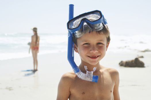 Little Boy Wearing Snorkel On Beach