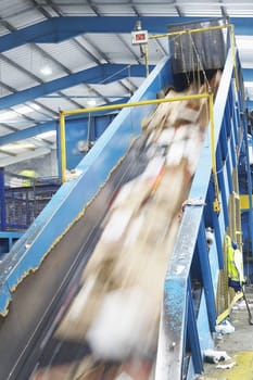 Motion of rubbish on conveyor belt in recycling factory