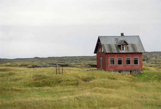 Old house in rugged landscape