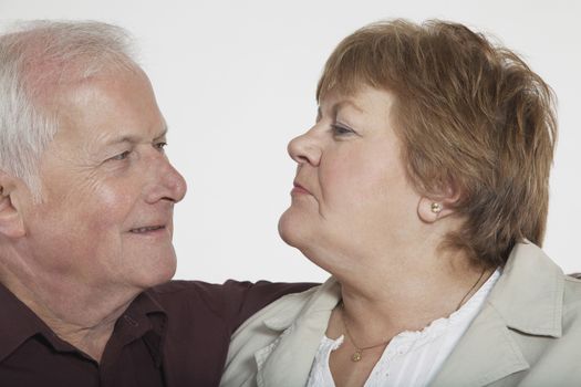 Middle-aged couple looking in eyes close-up