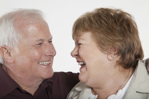 Middle-aged couple laughing close-up