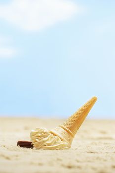 Fallen icecream in sand