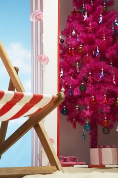 Pink christmas tree in beach storage cabin