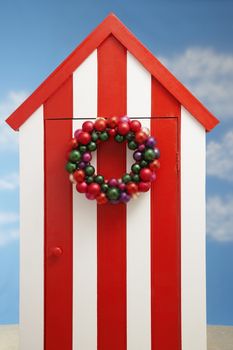 Beach storage cabin with christmas decoration on door