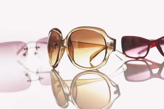 Three pairs of sunglasses studio shot