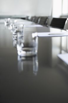 Closeup of empty glasses on conference table in office