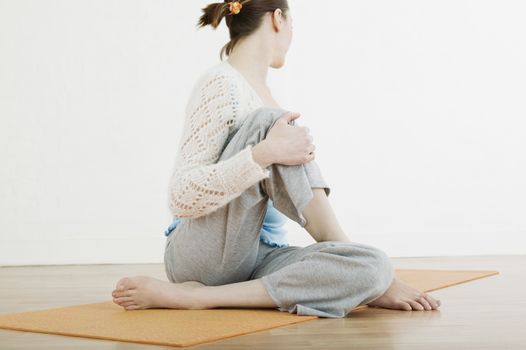 Teenage girl (16-17) performing yoga