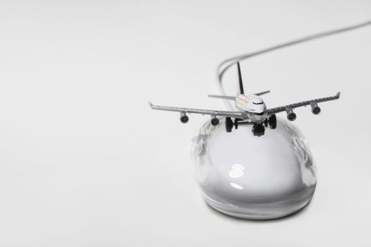 Jumbo jet on apple macintosh computer mouse digital composite