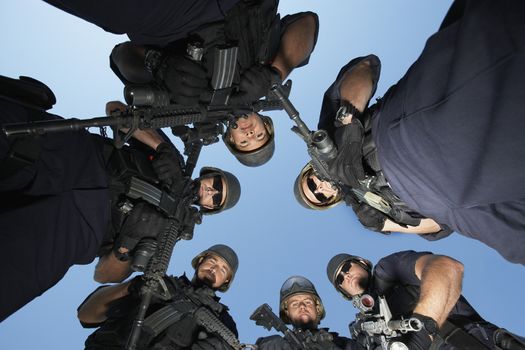 Group portrait of Swat officers standing in circle