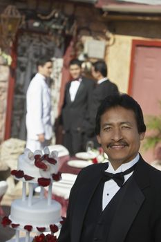 Portrait of a man wearing tuxedo at Quinceanera party