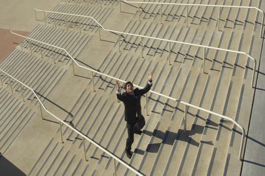 High angle view of businessman shouting on stairs