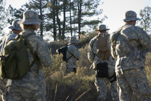 US army soldiers during training in forest selective focus