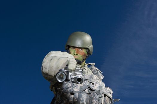 Portrait of soldier aiming to camera