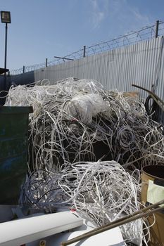 Heap of thrown wires in junkyard