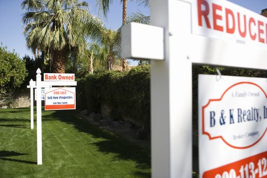 Real Estate Signs at Foreclosed Property
