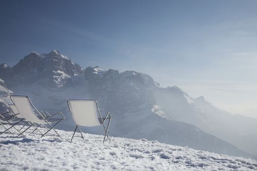 Lawn chairs on mountain peak