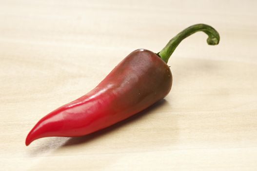 Red chili pepper on chopping board