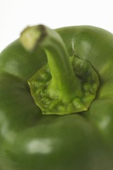 Detail of a green bell pepper isolated over white background