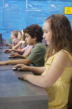 School children using computers in classroom