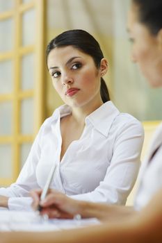 Two business women sitting in meeting