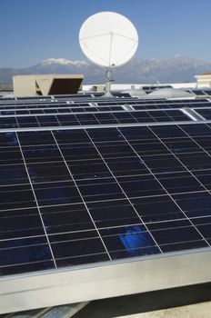 Solar Panels and Satellite Dish at Solar Power Plant