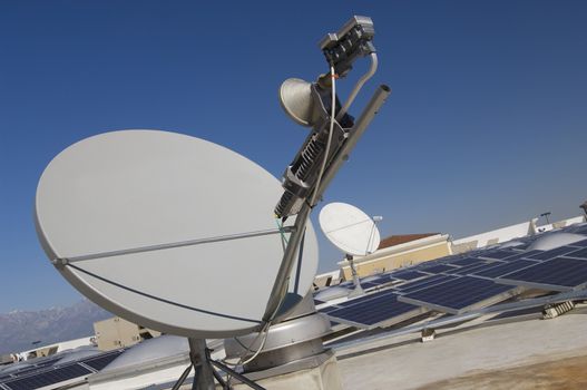 Satellite Dish with Solar Panels at Solar Power Plant