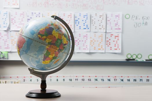 Globe on the desk in elementary classroom
