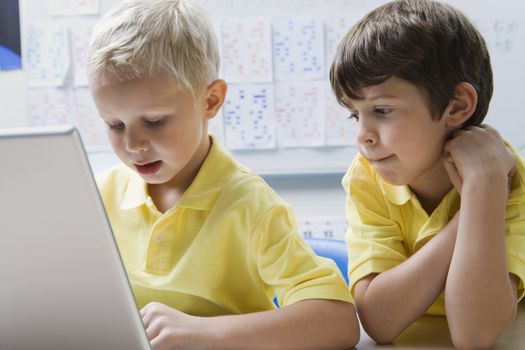 Schoolboys Using a Laptop