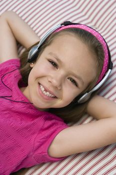 Little Girl Listening to Headphones