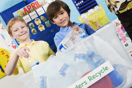 Elementary Students with Recycling Container