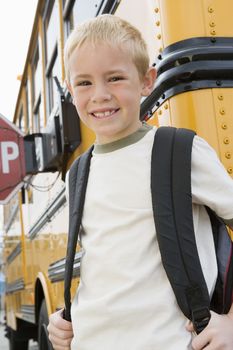 School Boy by School Bus