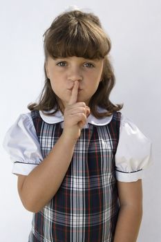 Elementary Student with Finger on Lips