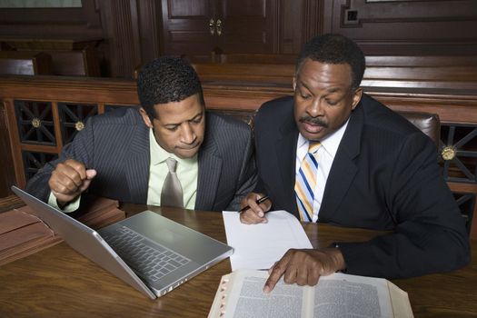 Two men working in court