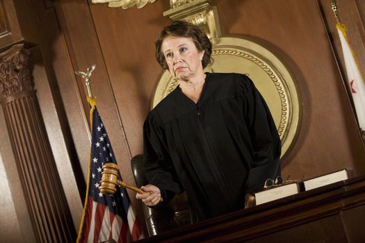 Judge forming a judgement in a courtroom