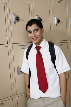 High School Boy Standing by Lockers