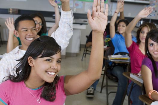 High School Students Raising Their Hands in Class