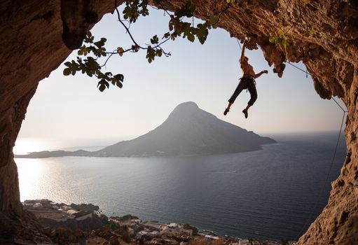 Rock climber at sunset. Kalymnos, Greece.