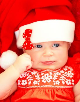 Newborn baby wearing Christmas costume