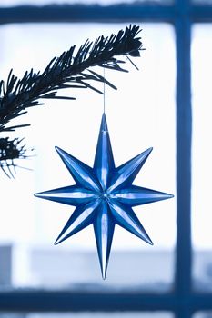Closeup of blue star shape Christmas ornament
