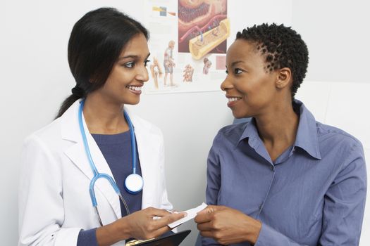 Female doctor and patient smiling