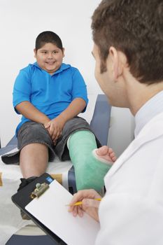 Doctor interviewing boy-patient
