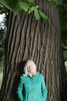 Woman Standing Beneath a Tree
