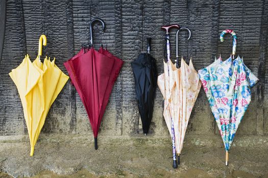 Colorful Umbrellas Leaning Against a Wall