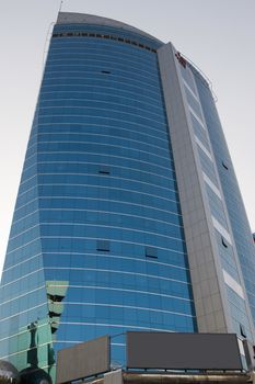 Low angle view of tall commercial building in Deira, Dubai, UAE
