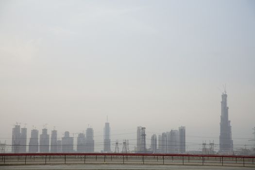 Dubai‚Äôs skyline from Nad Al Sheba Camel Racetrack, Dubai, UAE