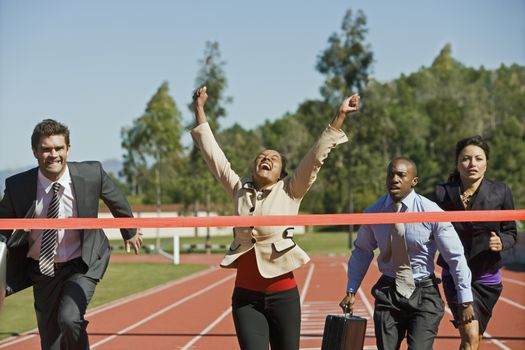 Business People Crossing the Winning Line