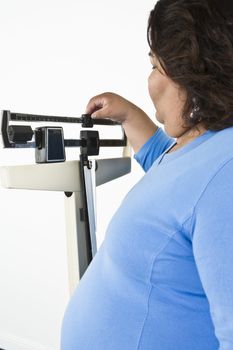 Woman using weight scales