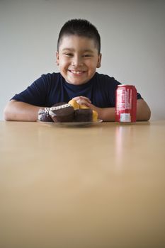 Portrait of pre-teen (10-12) boy about to eat dessert